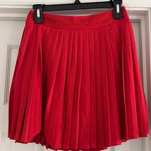 Size medium red pleated skirt.